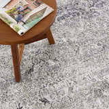 Close-up of the Gray Holi-4607 Washable Area Rug, showcasing its traditional vintage pattern and soft gray and white colors. Styleshot
