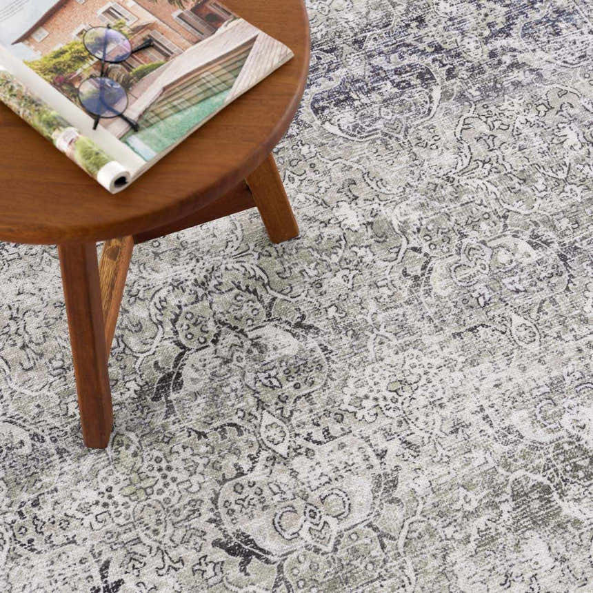 Close-up of the Gray Holi-4607 Washable Area Rug, showcasing its traditional vintage pattern and soft gray and white colors. Styleshot