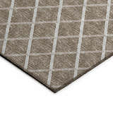 Close-up of Dalyn Machine Indoor/Outdoor York YO1 Taupe Washable Area Rug with a beige and ivory geometric plaid pattern.
