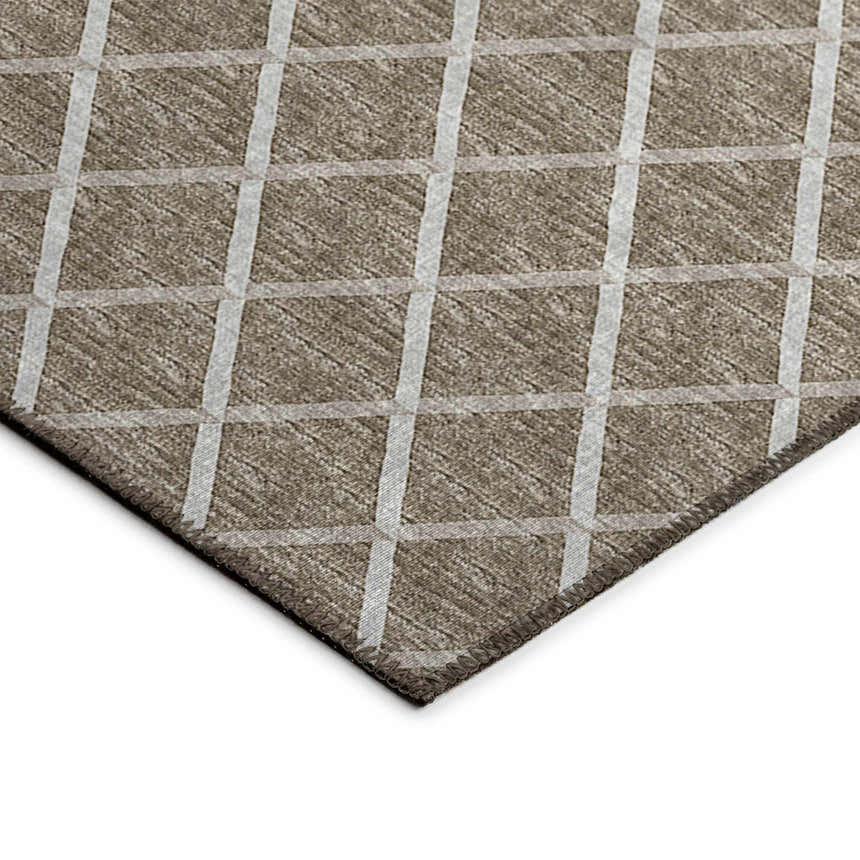 Close-up of Dalyn Machine Indoor/Outdoor York YO1 Taupe Washable Area Rug with a beige and ivory geometric plaid pattern.