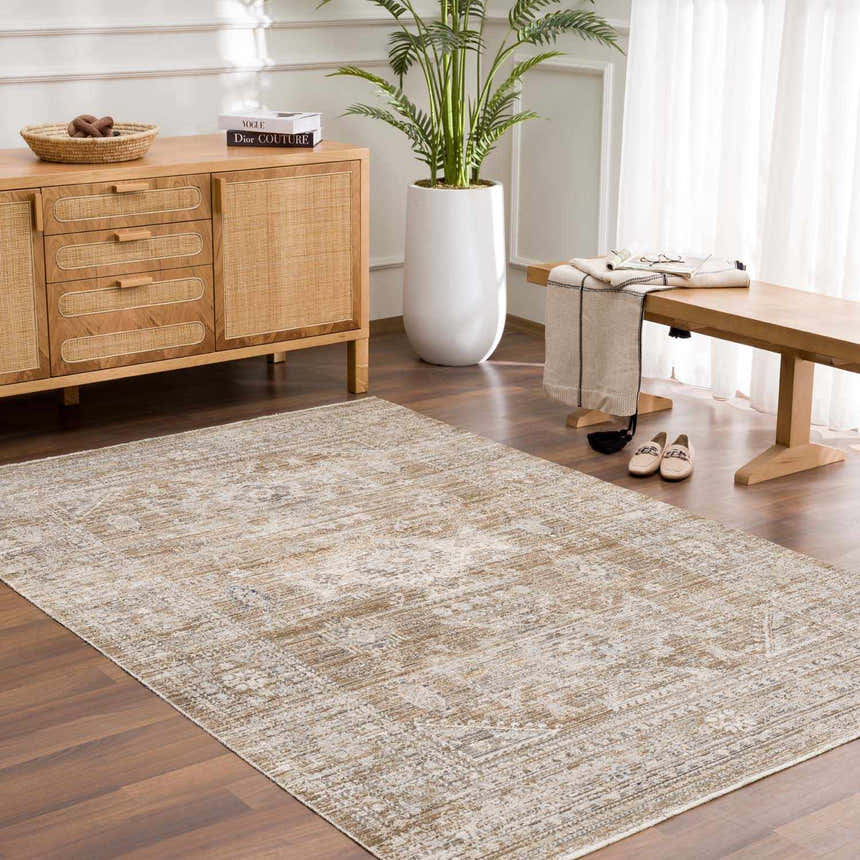 Entryway with wood floors and the brown, vintage-style Yamir Washable Outdoor Rug. Neutral tones and natural light. Roomscene-Rectangle
