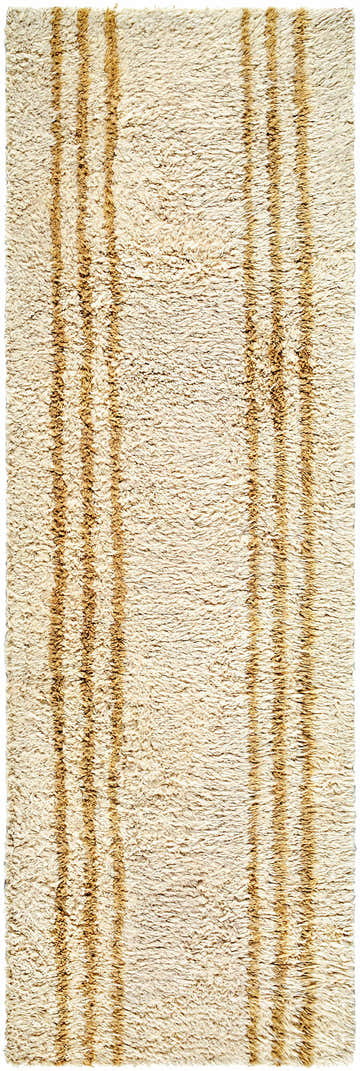 Close up of the Yahto Area Rug, a hand-tufted wool rug in camel and tan with a vertical stripe pattern. Design-Runner-268