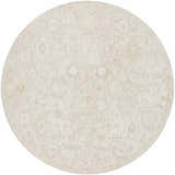 Close-up of a round Yonca Luxe Rug in ash and light silver. The rug has a traditional, floral-inspired pattern. Design-Round-7