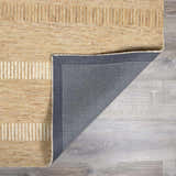Close-up of the hand-tufted Yoyko Area Rug. Tan and pearl wool rug with a geometric stripe design. Fold