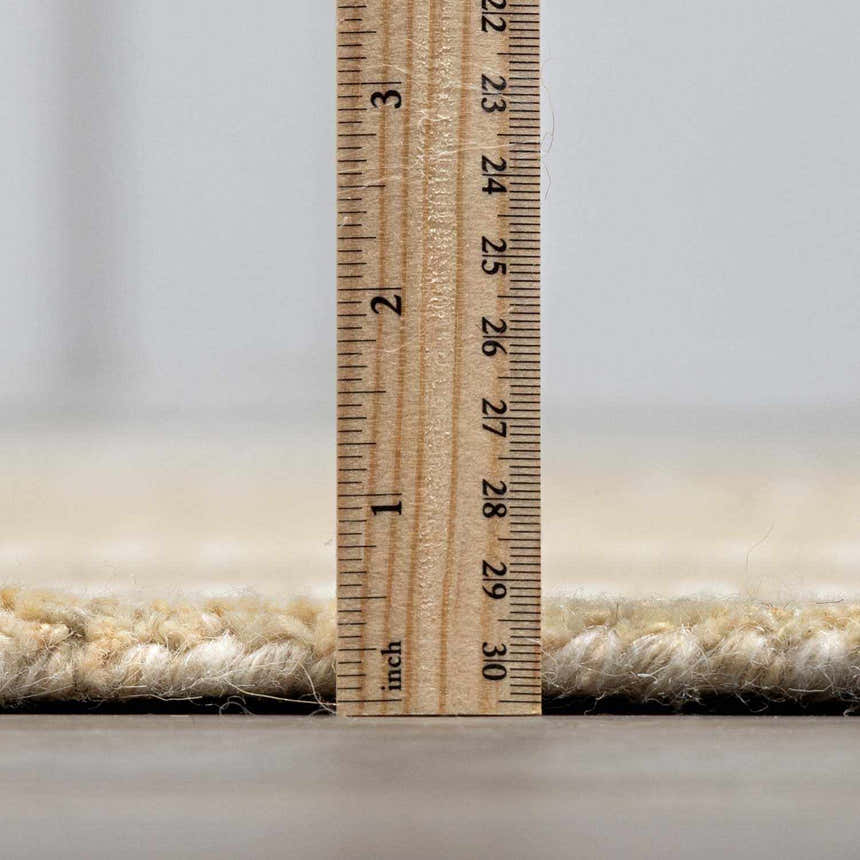 Close-up of the Yoyko Area Rug pile height, showing its thick, hand-tufted wool construction. Pile