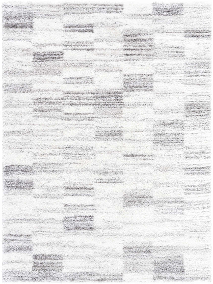 Close-up of the Alaura Area Rug, a shag rug with a contemporary ivory and peach block pattern and soft texture. Design-Rectangle-537