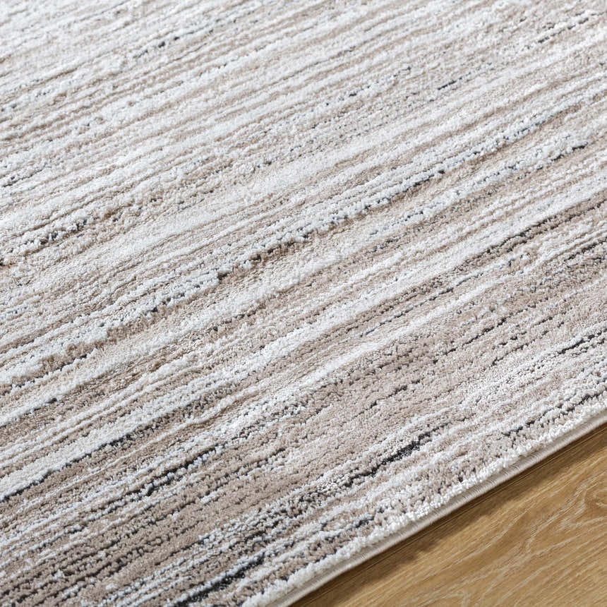 Close-up of Ainhoa Luxe Thick Area Rug, showing ivory, tan, and black linear pattern and plush texture. Texture