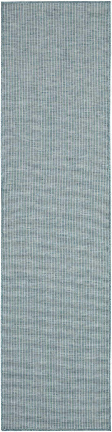 Close-up of the Nourison Positano Aqua rug. Modern design with a subtle, textured aqua and white pattern.