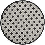Close-up of a round Nourison Aloha Black White Modern Area Rug featuring a diamond pattern.