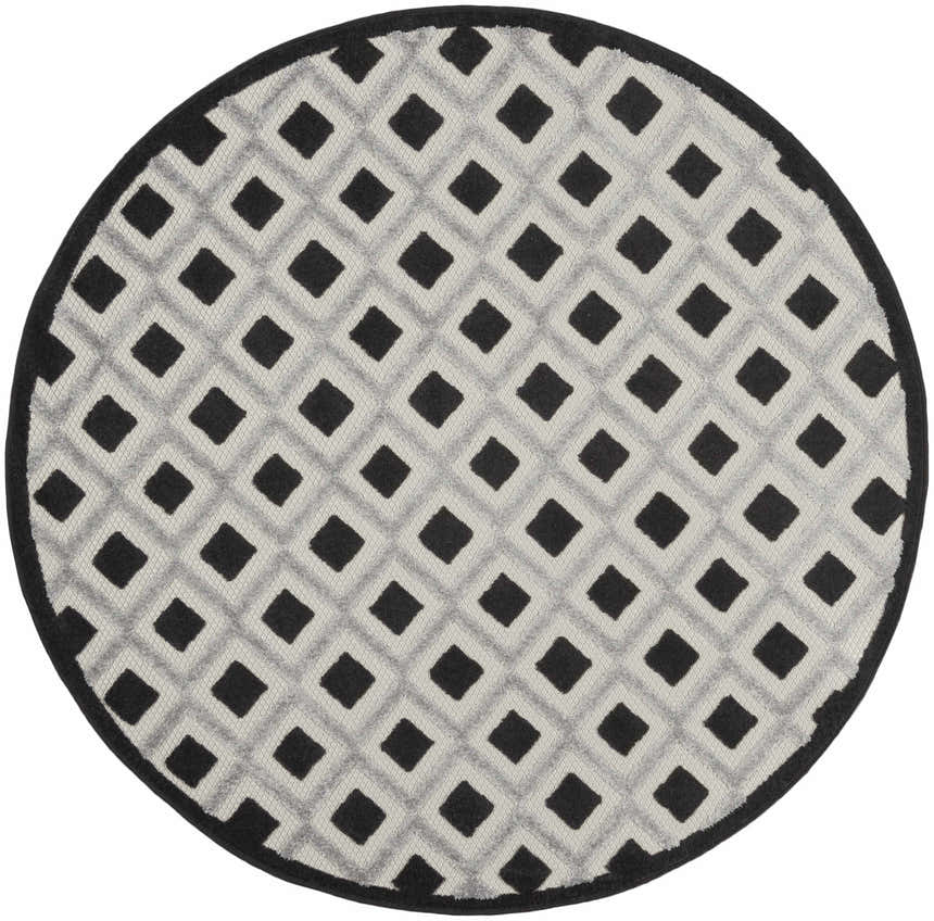Close-up of a round Nourison Aloha Black White Modern Area Rug featuring a diamond pattern.