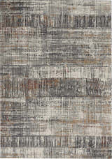Close-up of the Nourison Tangra Multicolor rug. Features a modern, abstract design with gray, white, and rust hues.