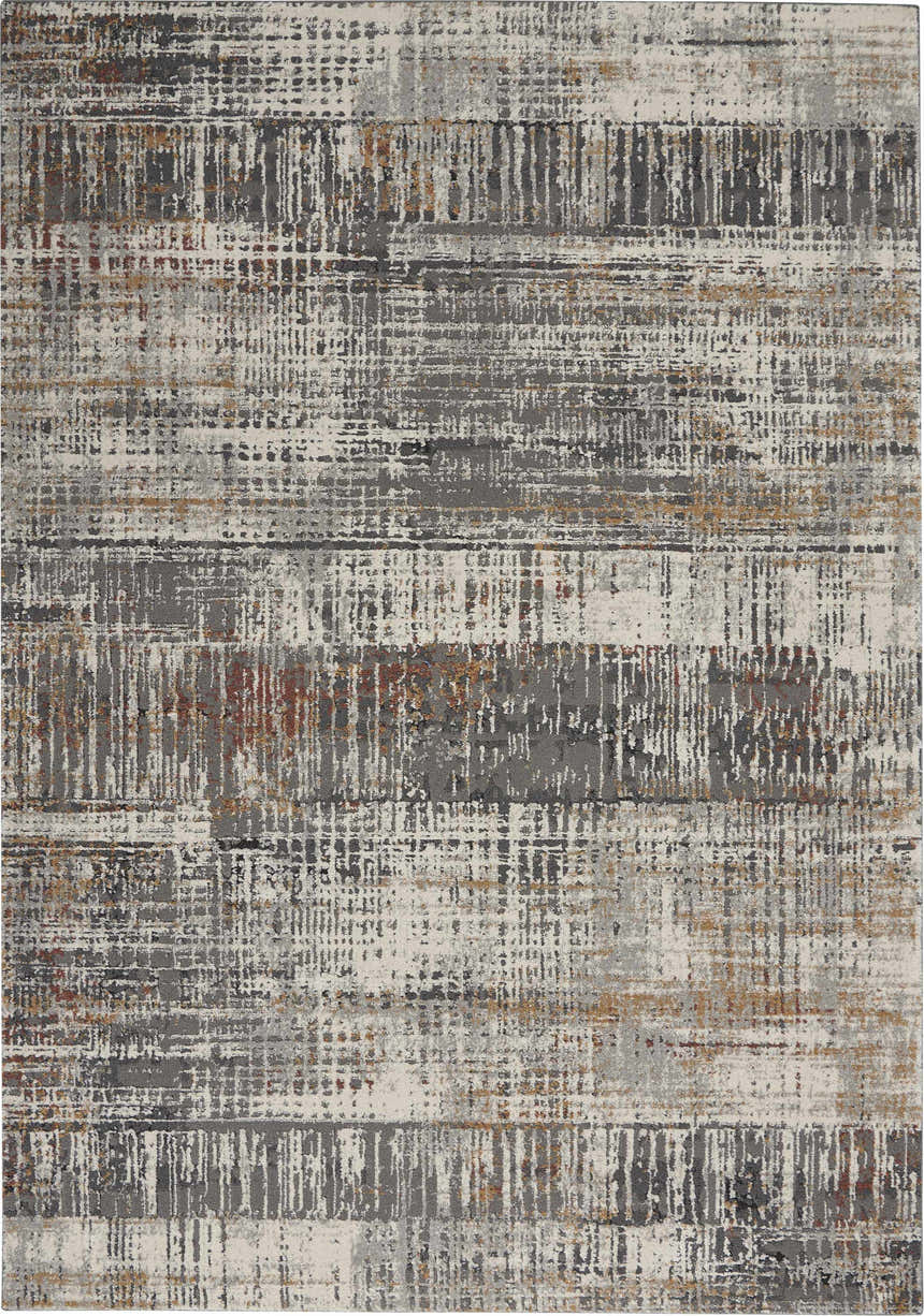 Close-up of the Nourison Tangra Multicolor rug. Features a modern, abstract design with gray, white, and rust hues.