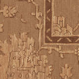 Close up of the brown vintage pattern on the Nourison Silk Pointe area rug.