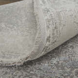 Close-up of Feizy Cadiz Taupe/Gray/Silver Area Rug showing abstract pattern, fringe detail, and soft texture. Fold