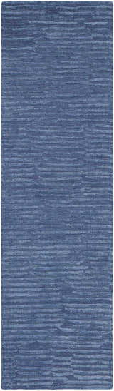 Close-up of Calvin Klein CK010 Linear Blue rug. Modern, handmade wool rug with a subtle horizontal stripe pattern.