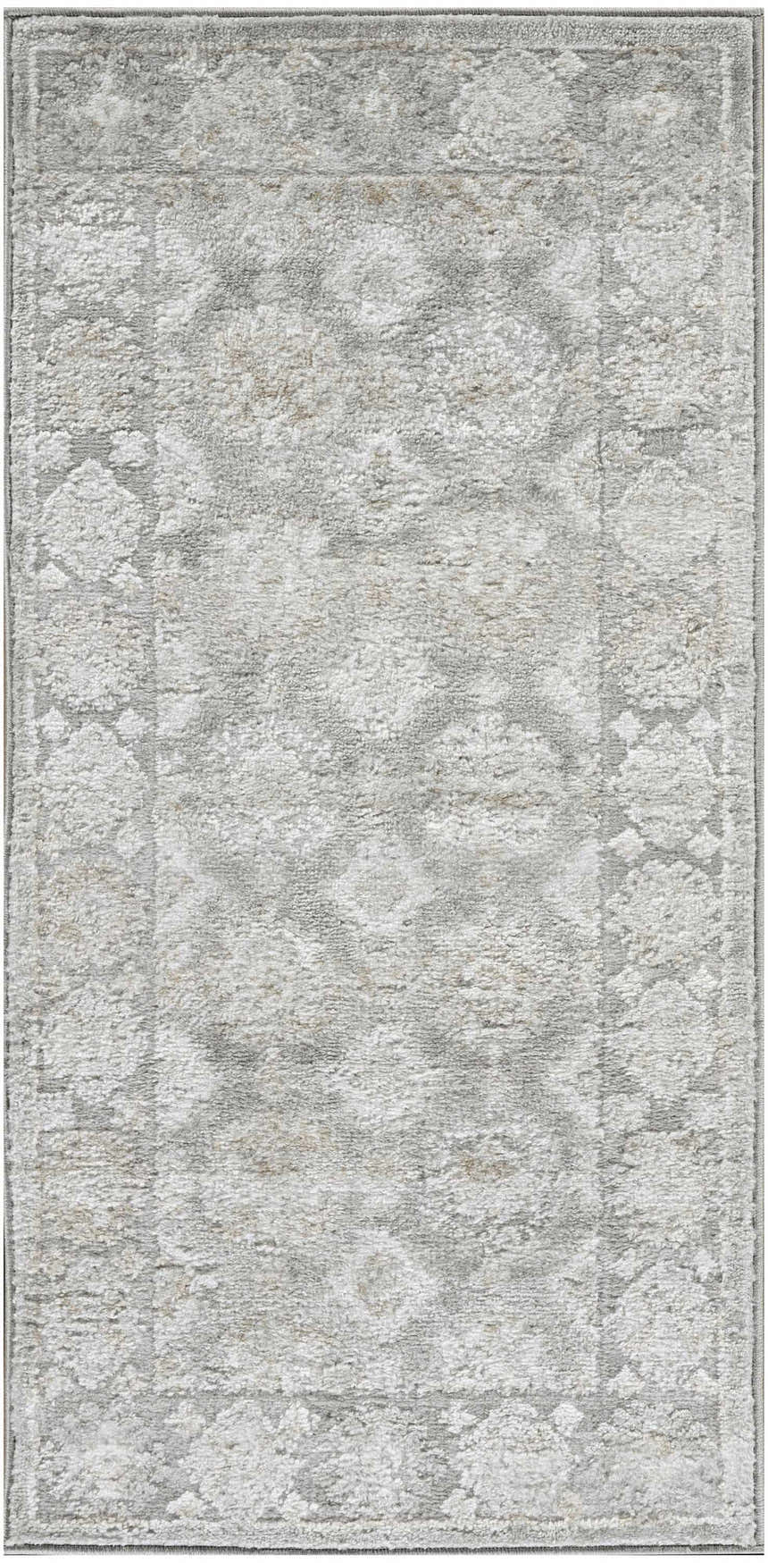Close-up of the Nourison Dekor Grey Vintage Indoor Area Rug, showing its high pile and subtle floral pattern.