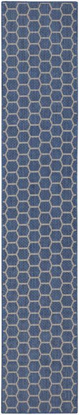 Close-up of the Nourison Twist Reversible Blue Modern Area Rug featuring a geometric hexagon pattern.