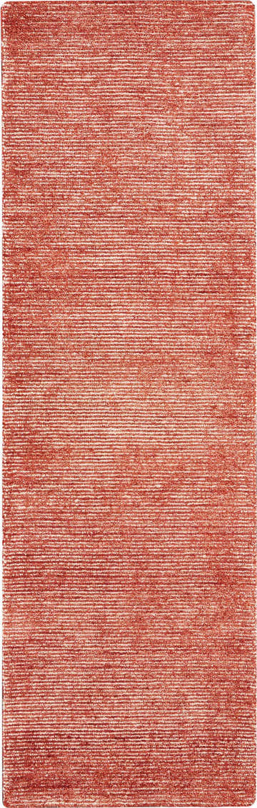 Close-up of the brick red Nourison Weston Rug, featuring a subtle horizontal stripe pattern and soft texture.