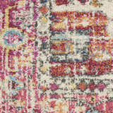 Close-up of the Nourison Passion Ivory Pink Bohemian rug, featuring a textured pile and chestnut, pink, and blue hues.