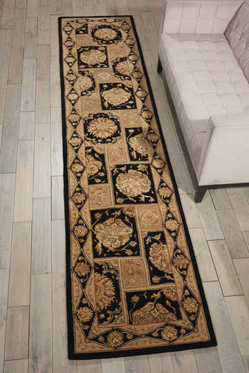 Living room scene with a Nourison 3000 Black runner rug on light wood floors next to a modern white sofa.