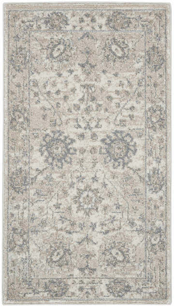 Close-up of the Nourison Moroccan Celebration Ivory/Sand rug. Vintage style with chestnut accents and a subtle floral pattern.