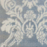 Close-up of the Nourison Elation Ivory Blue Vintage Rug, showcasing its high pile texture and chestnut-toned floral pattern.