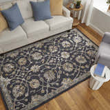 Living room scene with Feizy Prescott rug in blue, silver, and gray. Floral rug under sofa and chair on wood floor. Roomscene-Rectangle