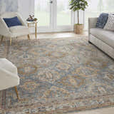Living room scene with a Nourison Sahar Blue Vintage Area Rug, light furniture, and a bright, airy feel.