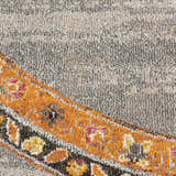 Close-up of Nourison Passionate Grey Bohemian rug. Features gray, orange, yellow, and red floral accents. Soft texture.