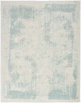 Close-up of the Nourison Harmony Ivory Aqua rug. Modern design with abstract aqua accents on an ivory base.