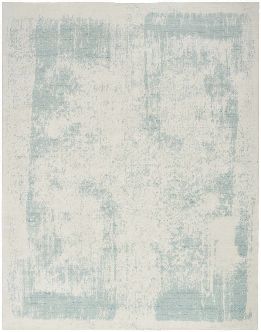 Close-up of the Nourison Harmony Ivory Aqua rug. Modern design with abstract aqua accents on an ivory base.