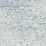 Close-up of the Nourison Silk Shadows Blue Green rug, showing its abstract pattern and textured, silk-like fibers.