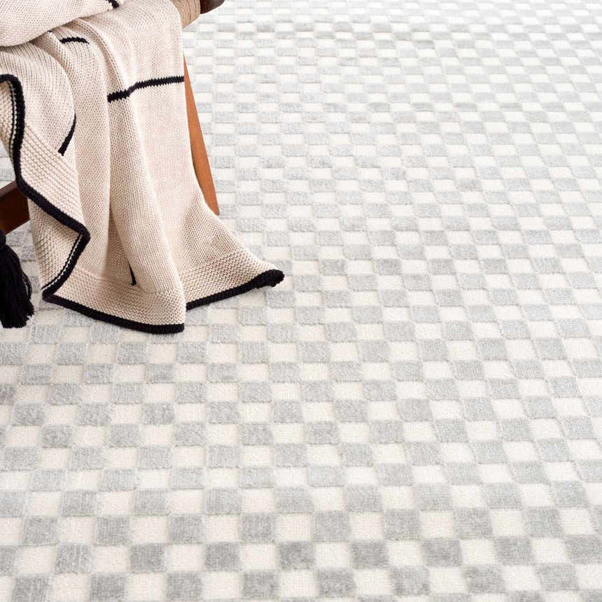 Close-up of the Gaiwan Cream Gray Washable Area Rug featuring a subtle checkerboard pattern and soft texture. Styleshot