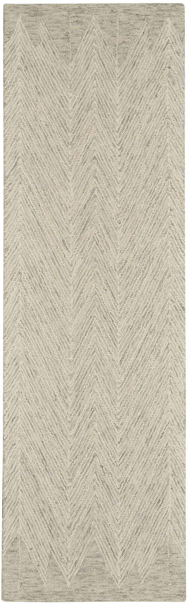Close-up of the Nourison Interlock Ivory/Grey rug. Features a modern chevron pattern and textured wool weave.