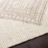 Close-up of the hand woven Aanislag Cream Wool Runner, showcasing its geometric pattern and textured wool construction. Texture