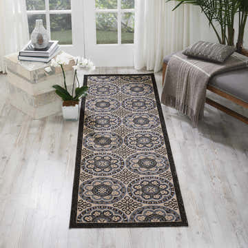 Entryway scene with Nourison Caribbean Ivory Charcoal rug, farmhouse style, taupe and charcoal floral pattern.