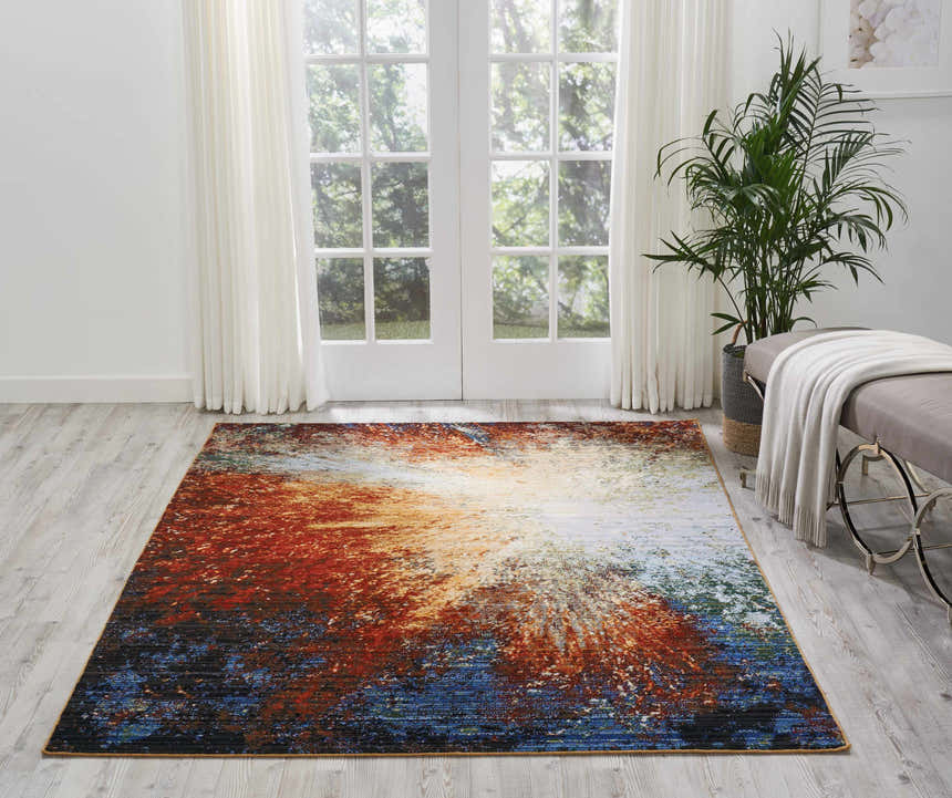 Bright living room with Nourison Chroma Red Flare rug, daybed, and plant.