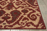 Close-up of Nourison Kindred Ivory/Red rug showing chestnut, ivory, and red floral pattern and texture.