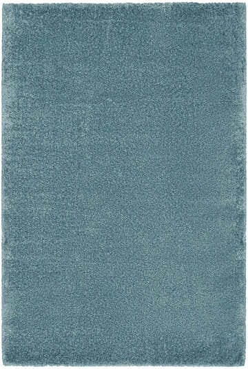 Close-up of the plush texture and aqua color of the Nourison Dreamy Shag area rug.