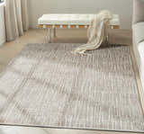 Modern living room with a Calvin Klein CK079 Notes Ivory Grey rug, white bench, and neutral tones.