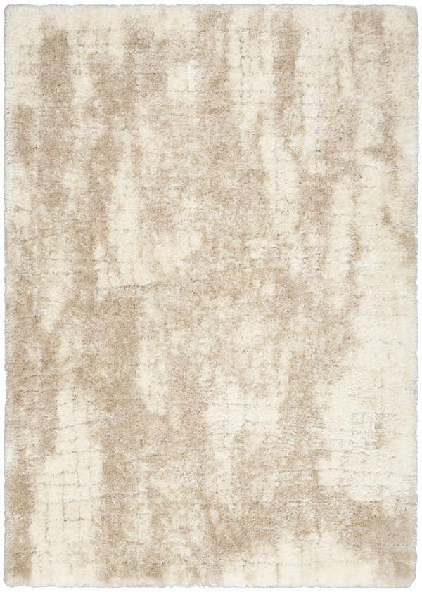 Close-up of the Nourison Dreamy Shag Ivory Beige rug. Soft, plush shag texture with subtle chestnut color variations.