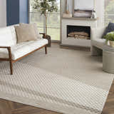 Living room with a white sofa and Nourison Care Free Beige Modern Area Rug.