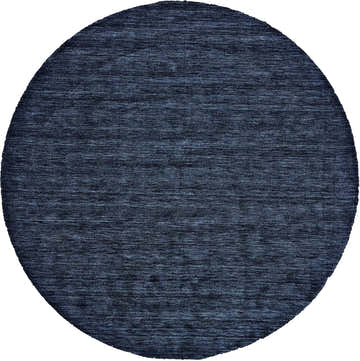 Close-up of round Feizy Luna Modern Solid blue area rug showing wool texture and hand woven construction. Design-Round