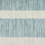 Close-up of the woven texture of the Nourison Positano Aqua Ivory area rug, showing the aqua and ivory stripes.