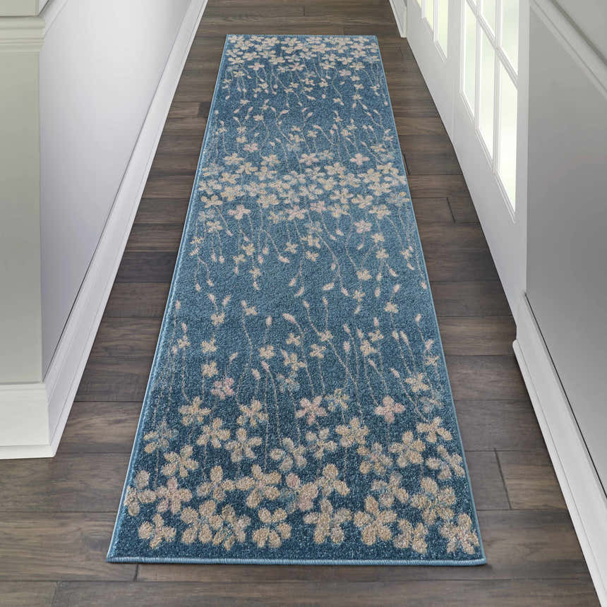 Hallway with Nourison Tranquil Turquoise rug runner, floral pattern, on dark wood floor. Aqua and beige tones.