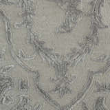 Close-up of the Nourison Opaline Taupe Vintage Area Rug showing the ivory, textured floral pattern.