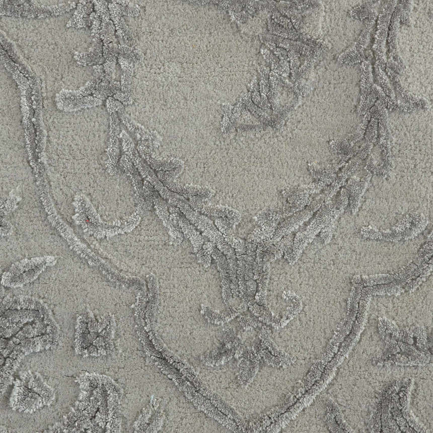 Close-up of the Nourison Opaline Taupe Vintage Area Rug showing the ivory, textured floral pattern.