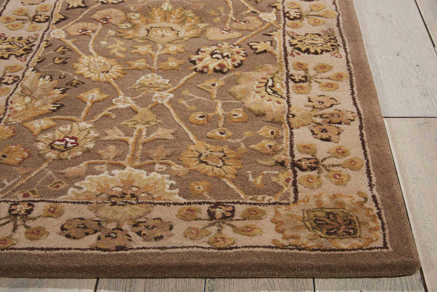 Close-up of the floral design and texture of the Nourison 3000 Taupe Persian Area Rug. Taupe, ivory, and gold tones.