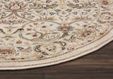Close-up of the round Nourison Walden Ivory rug. Features chestnut, tan, and blue floral and paisley design on an ivory background.