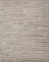 Close-up of the Nourison OCEAN Sand area rug. Sandstone color with a subtle, linear texture. Handmade rug.